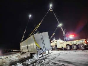 Deans Heavy-duty towing lifting a semi trailer out of a ditch